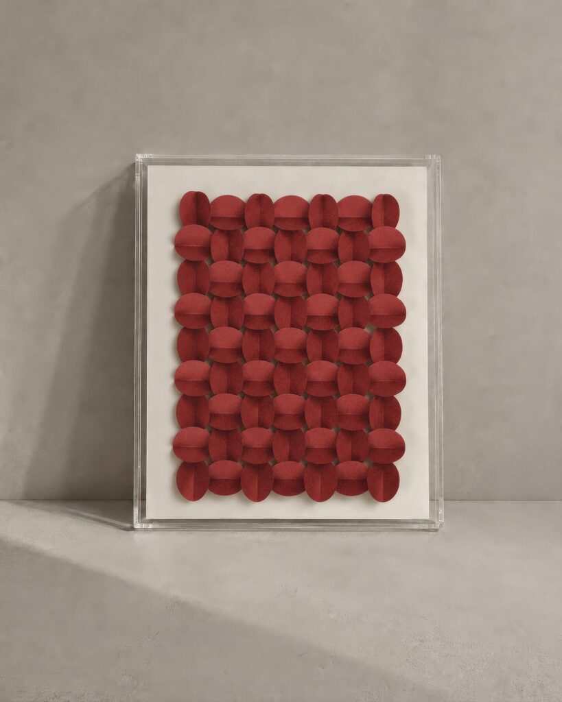 Cuadro de círculos en relieve color rojo sobre fondo blanco